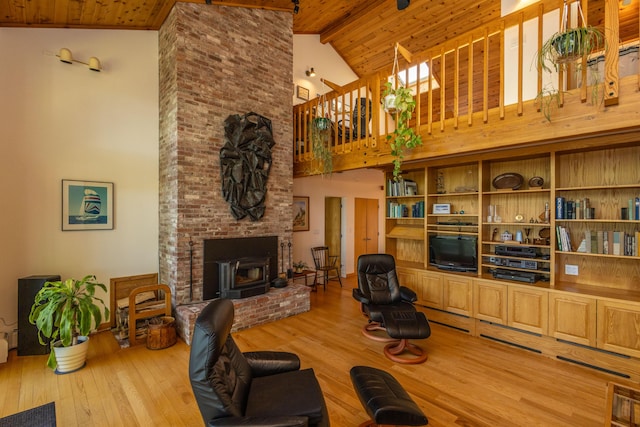 5 Spring Mountain Dr, Rockport, ME 04856 - living room with high vaulted ceiling, wood ceiling with exposed beams, hardwood / wood-style floors, a brick fireplace, and stairway