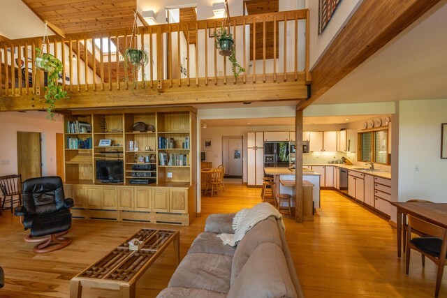 5 Spring Mountain Dr, Rockport, ME 04856 - living area with high vaulted ceiling and light wood-style floors