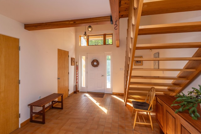 5 Spring Mountain Dr, Rockport, ME 04856 - foyer with beam ceiling, stairs, light tile patterned floors, and baseboards