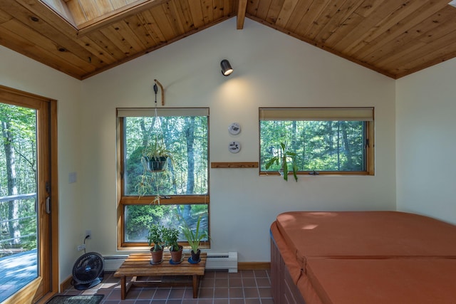 5 Spring Mountain Dr, Rockport, ME 04856 - tiled bedroom featuring multiple windows, vaulted ceiling, a baseboard radiator, a skylight, and wooden ceiling