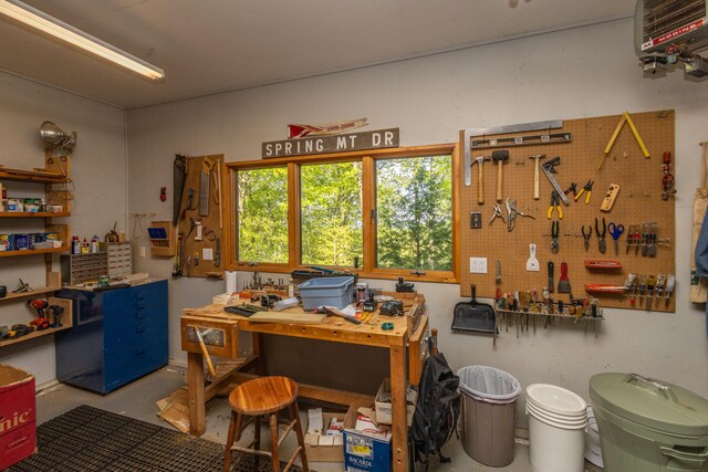 5 Spring Mountain Dr, Rockport, ME 04856 - office area with a workshop area, concrete floors, and a heating unit