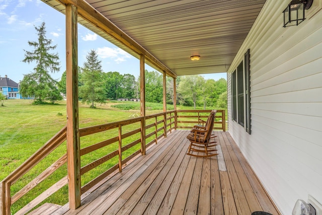 612 Airline Rd, Amherst, ME 04605 - wooden porch featuring a yard and view of scattered trees