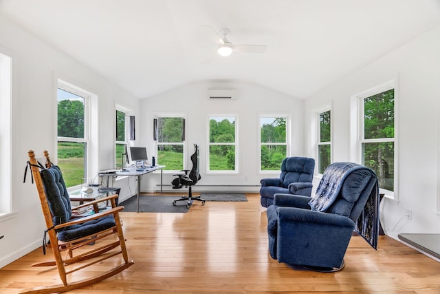 612 Airline Rd, Amherst, ME 04605 - living area featuring a desk, plenty of natural light, a wall mounted air conditioner, light wood-style floors, and vaulted ceiling
