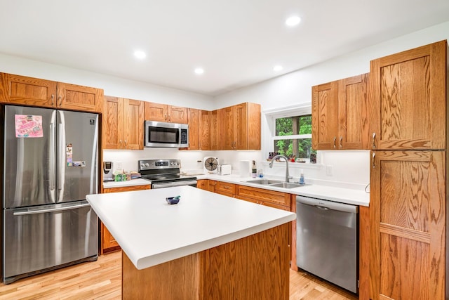 612 Airline Rd, Amherst, ME 04605 - kitchen with appliances with stainless steel finishes, light wood-style flooring, light countertops, brown cabinets, and recessed lighting