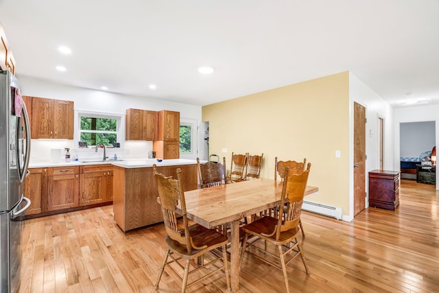 612 Airline Rd, Amherst, ME 04605 - dining area with light wood finished floors, a baseboard radiator, and recessed lighting