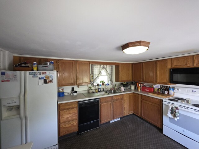 18 Cedar Ln, Belfast, ME 04915 - kitchen featuring black appliances, a sink, light countertops, and brown cabinetry