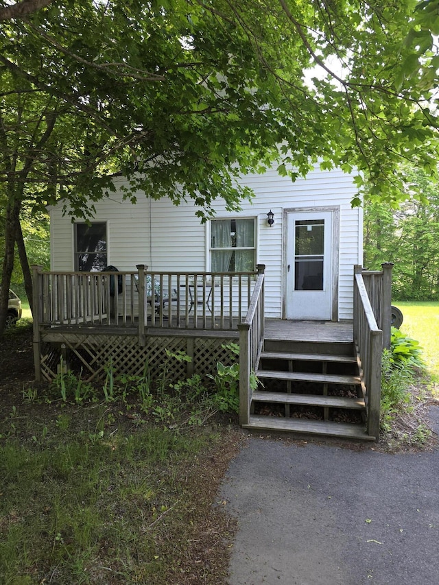 18 Cedar Ln, Belfast, ME 04915 - doorway to property featuring a wooden deck