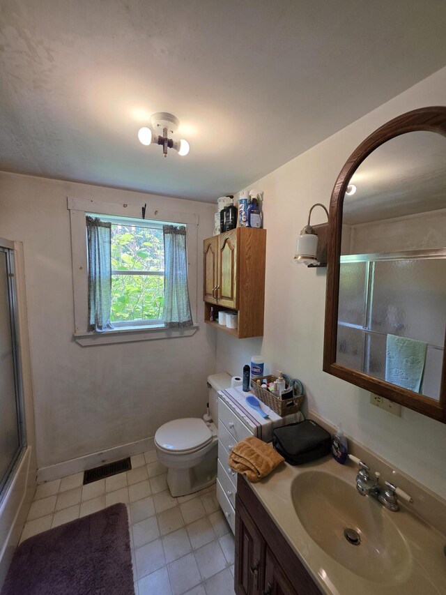 18 Cedar Ln, Belfast, ME 04915 - full bath featuring vanity, toilet, tile patterned flooring, and baseboards