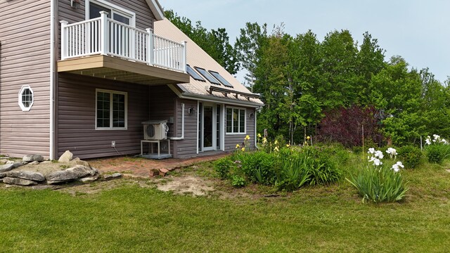 55 Pember Rd, Levant, ME 04456 - view of side of home with a balcony, a yard, and a cooling unit