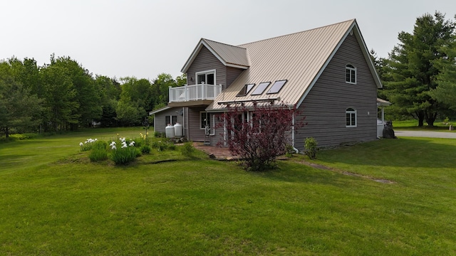 55 Pember Rd, Levant, ME 04456 - view of home's exterior with a yard, metal roof, and a wooden deck