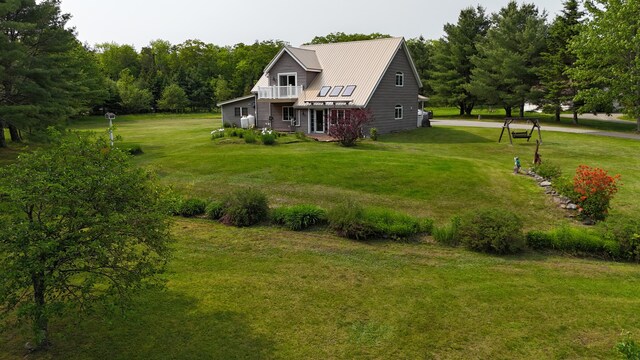 55 Pember Rd, Levant, ME 04456 - rear view of house featuring a lawn, metal roof, and a standing seam roof