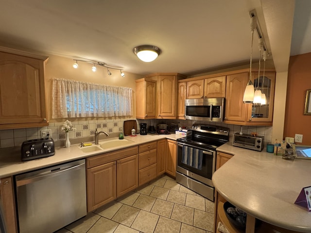 55 Pember Rd, Levant, ME 04456 - kitchen featuring stainless steel appliances, a sink, track lighting, and backsplash