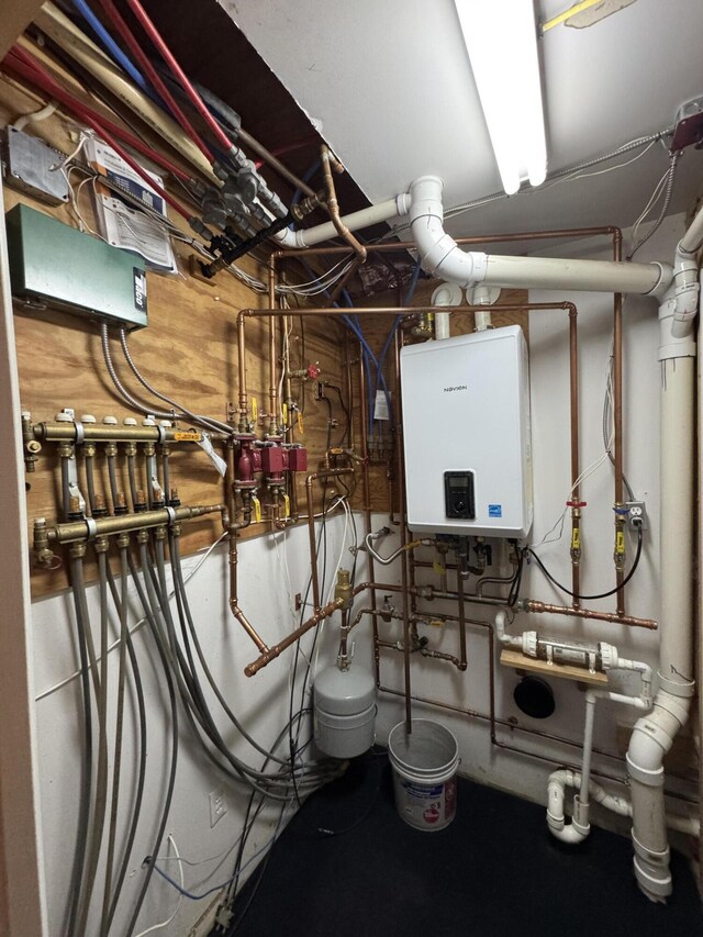 55 Pember Rd, Levant, ME 04456 - utility room featuring tankless water heater