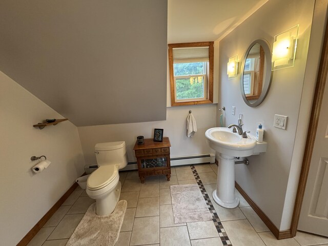 55 Pember Rd, Levant, ME 04456 - bathroom with baseboard heating, toilet, tile patterned floors, and baseboards