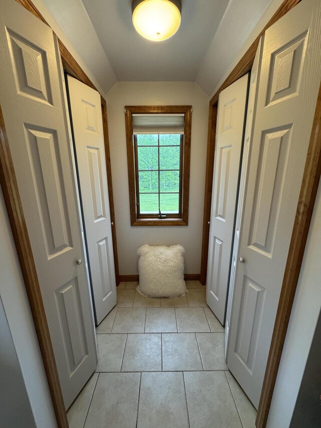 55 Pember Rd, Levant, ME 04456 - bathroom with vaulted ceiling, baseboards, and tile patterned floors