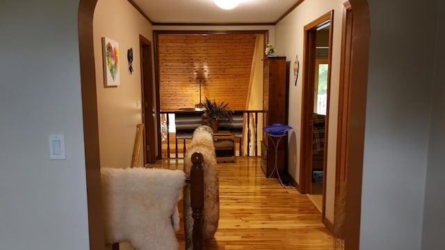55 Pember Rd, Levant, ME 04456 - hall featuring arched walkways, light wood-style floors, and ornamental molding