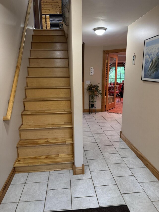 55 Pember Rd, Levant, ME 04456 - stairway with tile patterned floors and baseboards
