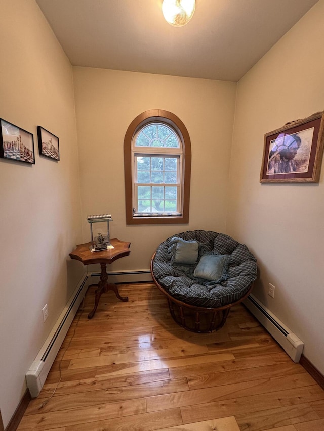 55 Pember Rd, Levant, ME 04456 - living area featuring baseboard heating, light wood-style flooring, and baseboards