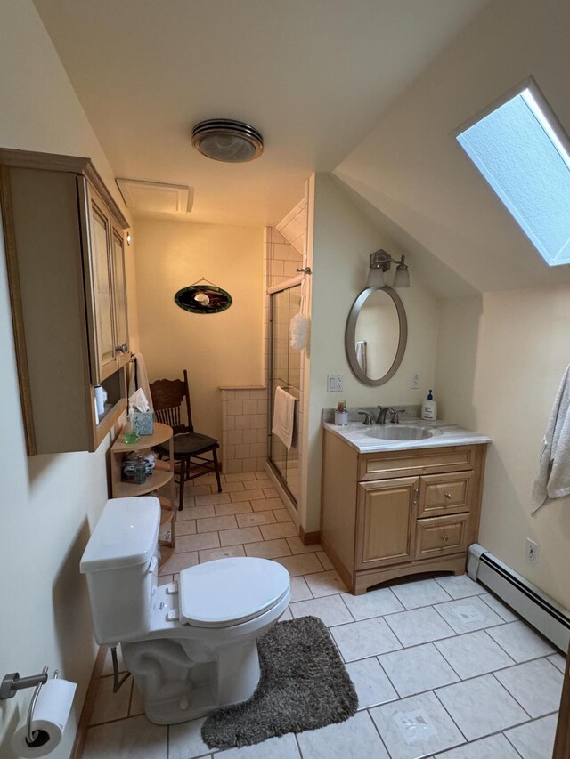 55 Pember Rd, Levant, ME 04456 - full bath featuring a skylight, a shower stall, toilet, tile patterned floors, and vanity