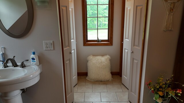 55 Pember Rd, Levant, ME 04456 - bathroom featuring tile patterned floors, a closet, baseboards, and a sink