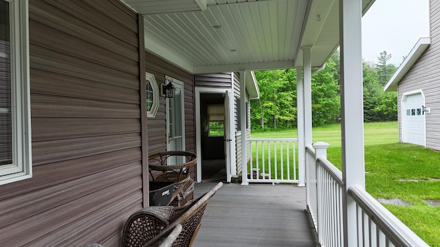 55 Pember Rd, Levant, ME 04456 - porch with a lawn and a garage