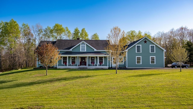 815 Grant Rd, Corinth, ME 04427 - back of property with covered porch and a lawn