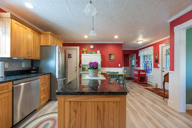 815 Grant Rd, Corinth, ME 04427 - kitchen with stainless steel appliances, light wood-type flooring, a baseboard heating unit, a kitchen island, and crown molding