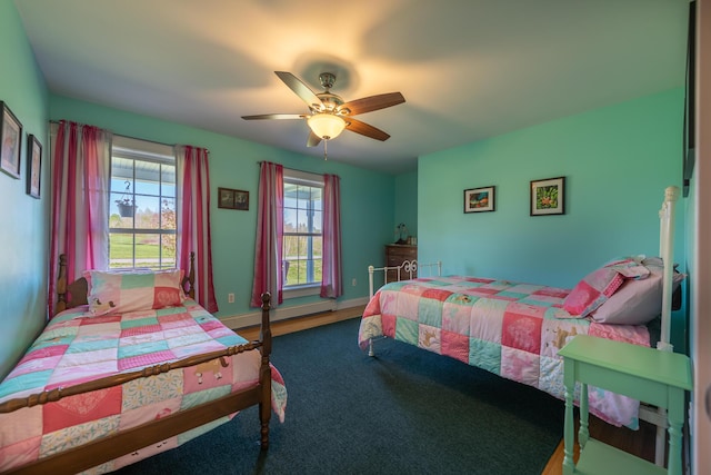815 Grant Rd, Corinth, ME 04427 - bedroom with baseboard heating and a ceiling fan