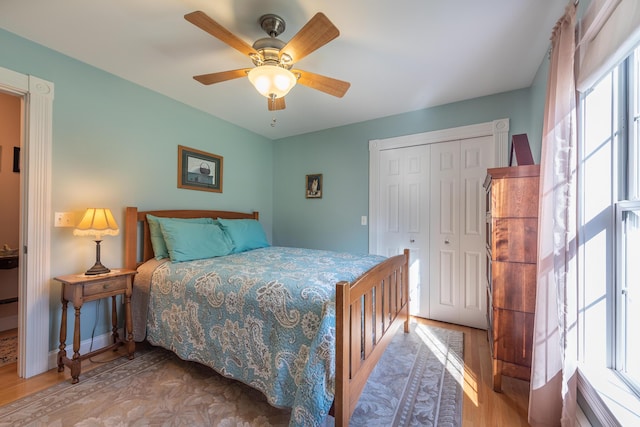 815 Grant Rd, Corinth, ME 04427 - bedroom with wood finished floors, a closet, and a ceiling fan