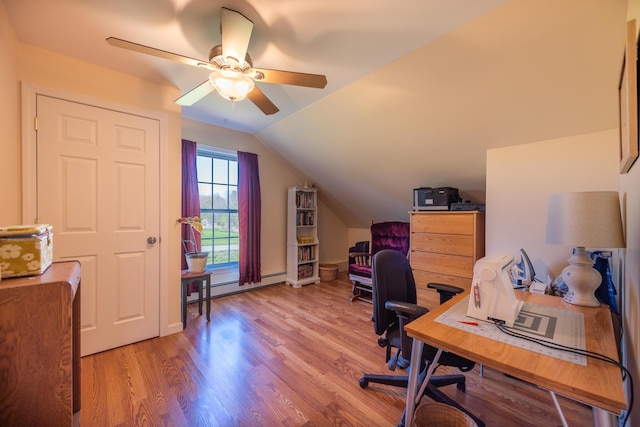 815 Grant Rd, Corinth, ME 04427 - office featuring wood finished floors, vaulted ceiling, ceiling fan, and a baseboard radiator