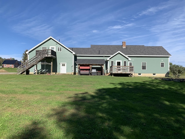 815 Grant Rd, Corinth, ME 04427 - back of house with a deck, a lawn, stairs, and a chimney