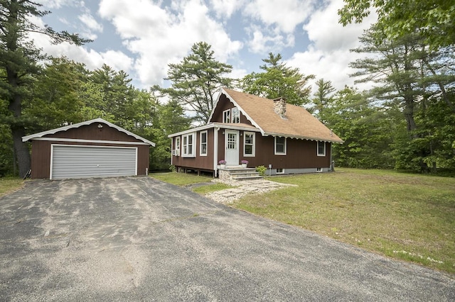 37 Hubbard Rd, Berwick, ME 03901 - view of front of property featuring an outdoor structure, a detached garage, and a front lawn