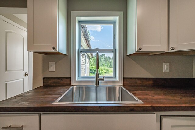 58 Pequawket Trl, Baldwin, ME 04024 - kitchen with wooden counters and white cabinets