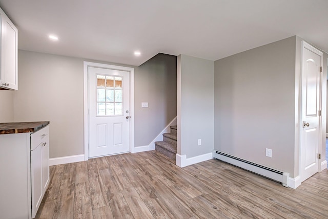 58 Pequawket Trl, Baldwin, ME 04024 - kitchen featuring baseboard heating, light wood-style floors, white cabinets, wood counters, and recessed lighting