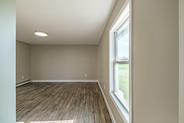 58 Pequawket Trl, Baldwin, ME 04024 - unfurnished room with baseboard heating, dark wood-type flooring, and plenty of natural light