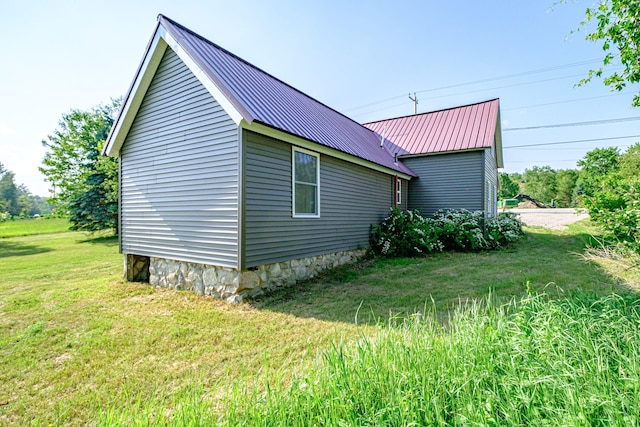 58 Pequawket Trl, Baldwin, ME 04024 - view of side of home featuring a metal roof and a lawn