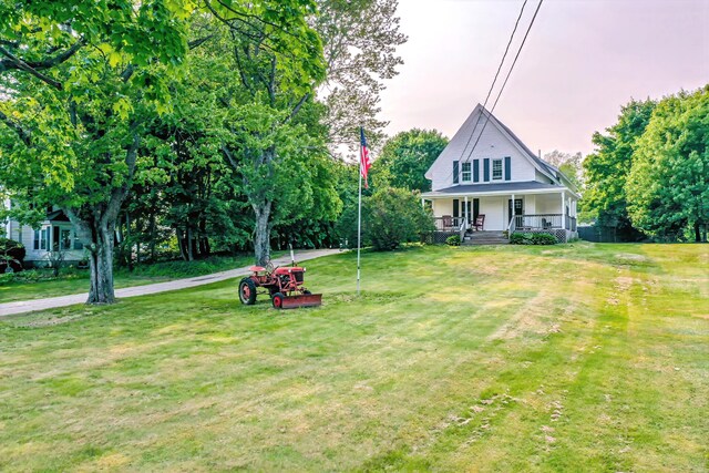 304 Main Rd N, Hampden, ME 04444 - view of front of property featuring a porch and a front yard