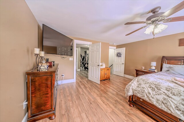304 Main Rd N, Hampden, ME 04444 - bedroom with baseboards, light wood-style floors, and ceiling fan