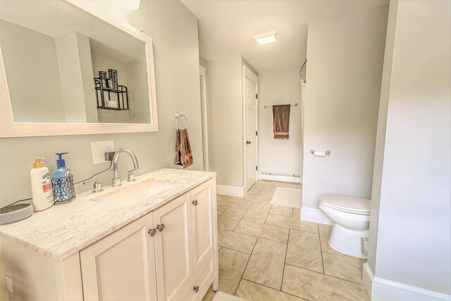 304 Main Rd N, Hampden, ME 04444 - full bathroom with vanity, marble finish floors, toilet, baseboards, and a shower