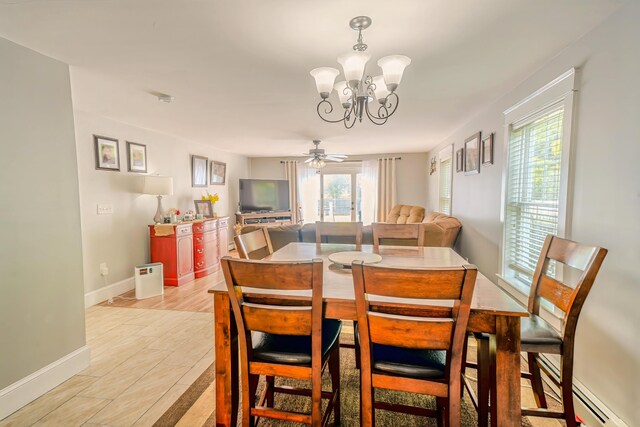 304 Main Rd N, Hampden, ME 04444 - dining area with a baseboard heating unit, a chandelier, plenty of natural light, and baseboards