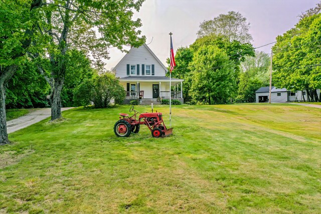 304 Main Rd N, Hampden, ME 04444 - view of front facade featuring a porch and a front lawn