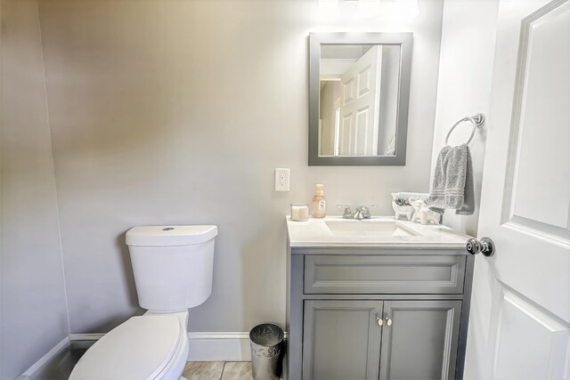 304 Main Rd N, Hampden, ME 04444 - bathroom featuring toilet, vanity, and baseboards