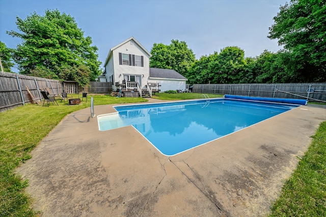 304 Main Rd N, Hampden, ME 04444 - view of swimming pool with a wooden deck, a patio area, and an outdoor fire pit