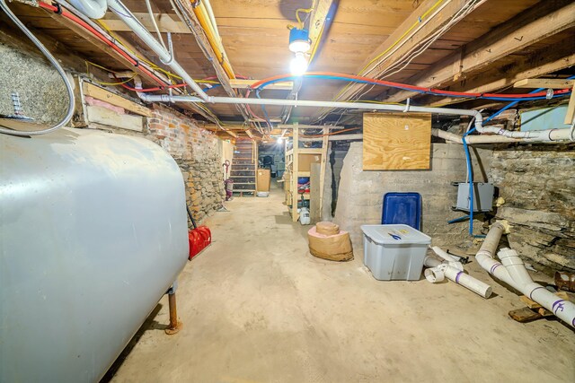 304 Main Rd N, Hampden, ME 04444 - unfinished basement featuring oil tank