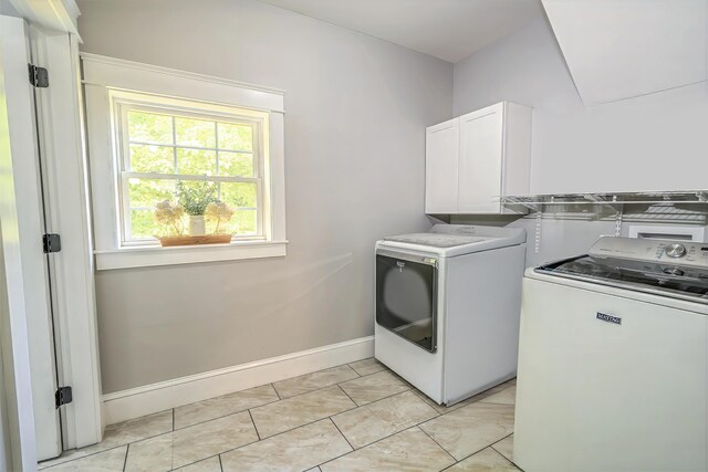 304 Main Rd N, Hampden, ME 04444 - laundry area featuring separate washer and dryer, cabinet space, and baseboards
