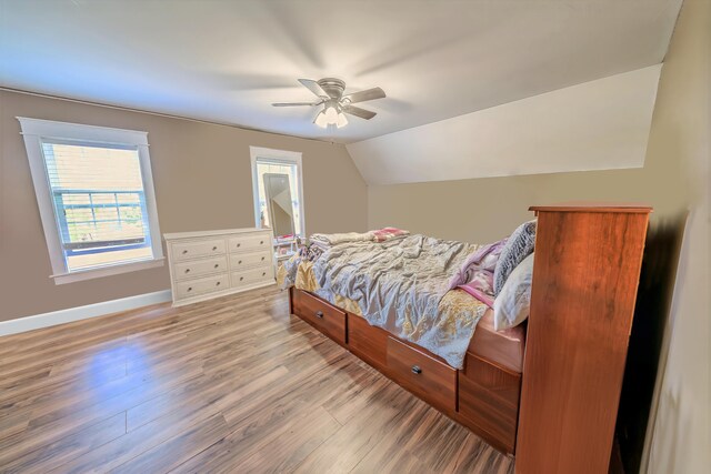 304 Main Rd N, Hampden, ME 04444 - bedroom with light wood-style floors, baseboards, vaulted ceiling, and a ceiling fan