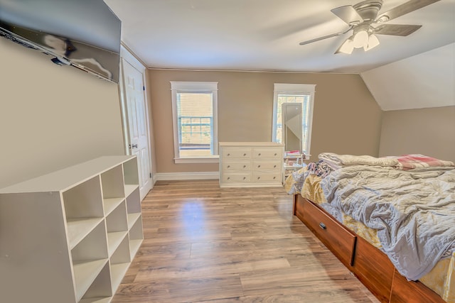 304 Main Rd N, Hampden, ME 04444 - bedroom featuring wood finished floors, lofted ceiling, ceiling fan, and baseboards