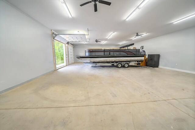 304 Main Rd N, Hampden, ME 04444 - garage with baseboards and ceiling fan