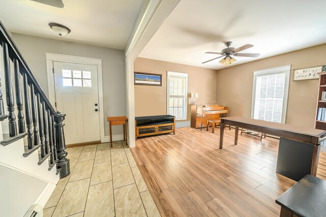 304 Main Rd N, Hampden, ME 04444 - foyer with a ceiling fan, stairs, light wood-style flooring, and baseboard heating