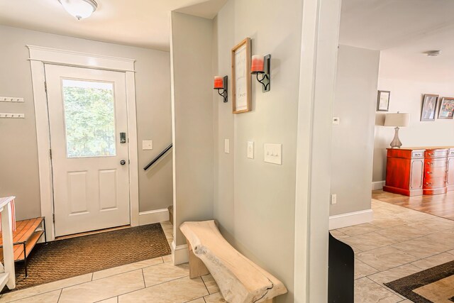 304 Main Rd N, Hampden, ME 04444 - entryway featuring light tile patterned flooring and baseboards